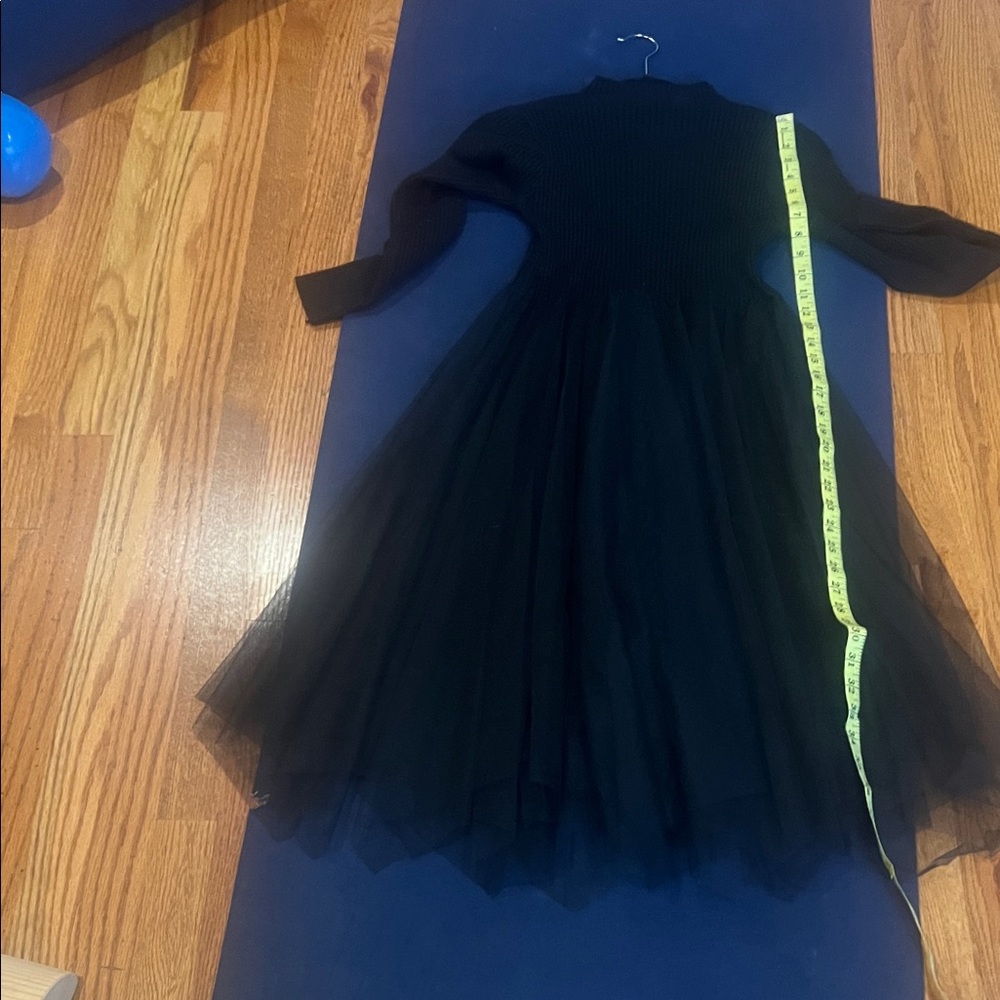 Elegant Black Long Sleeve sweater Dress with tuille skirt.